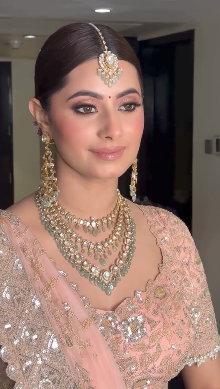 Soft glam bridal look with a dewy finish and rose flushed cheeks