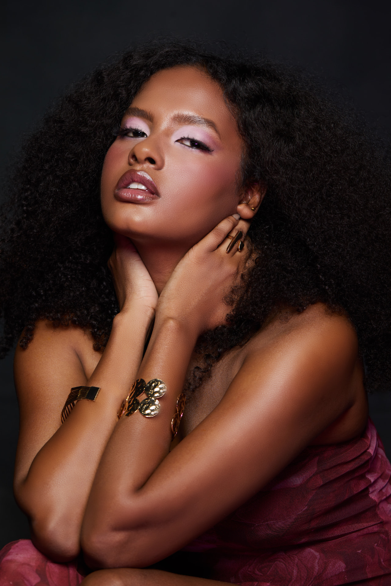 Editorial portrait with lilac shimmer eyes and gold jewellery